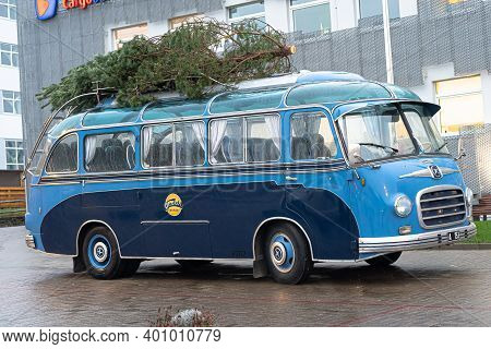 Tallinn. Estonia December 18, 2020 Old Bus, Christmas Tree On The Roof. Bus Station. High Quality Ph