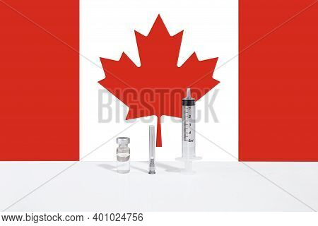 Flag Of Canada Illustrating Campaign For Global Vaccination Against Covid-19. Epidemic Virus