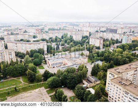 Aerial View Of Town With Socialist Soviet Panel Building At Cloudy Day. Buildings Were Built In The 