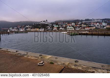 An Empty Marina In The Winter. Mountains In Fog In The Background. Picture From Molle, Scania County