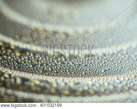 Macro View Of Drops On Golden Cold Lid Of Canned Beverage. Canned Drink With Condensation. Beautiful