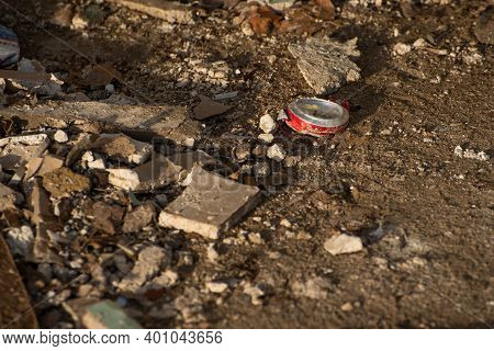 Trodden Can. Construction Site. Building Is Being Reconstructed. Garbage As Bricks, Woods, Metals, D