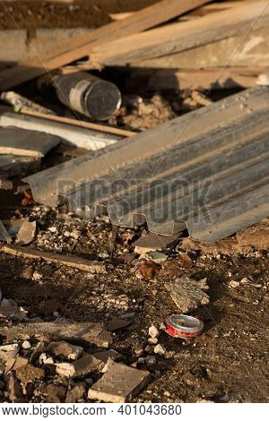 Trodden Can. Construction Site. Building Is Being Reconstructed. Garbage As Bricks, Woods, Metals, D