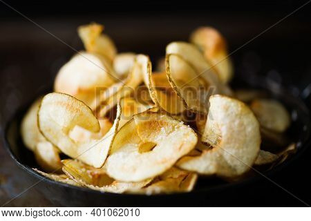 Close Up Of Rustic English Pub Grub Ribbon Cut Potato Crisps