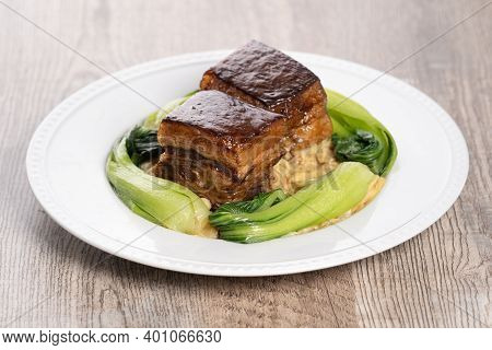 Dong Po Pork Meat In A Blue Plate With Broccoli With Red Background.