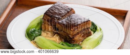 Dong Po Pork Meat In A Blue Plate With Broccoli With Red Background.