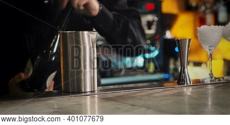 A Person Sitting At A Table With A Glass Of Wine. High Quality Photo