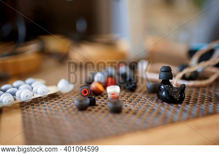 Lots of ear pads on the table in audio store