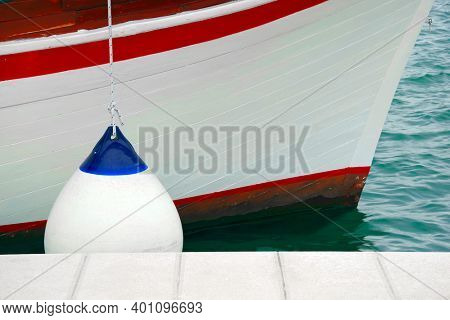 Details of boat side with protection fender sailing boating background with space for text and graphics