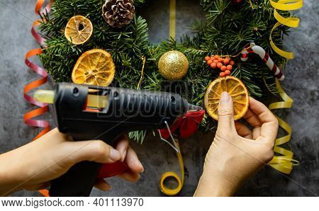 Women Making Christmas Wreath. New Year Holidaydecoration