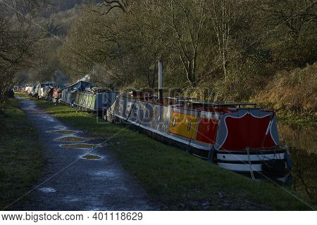 Bath, Somerset, United Kingdom - December 27, 2020: Narrowboats Illuminated By The Early Morning Win