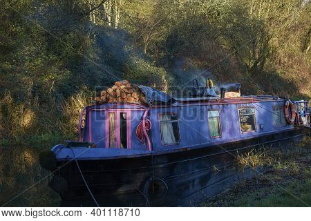 Bath, Somerset, United Kingdom - December 27, 2020: Narrowboats Illuminated By The Early Morning Win