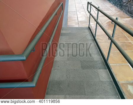 Access Ramp To The Building For The Disabled With Handrails. External Disabled Accessible Ramp For W