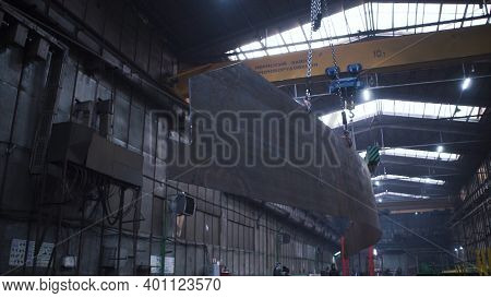 Metal Frame Hanging On Chains In Factory. Clip. Large Metal Panel Suspended On Chain In Factory Ware