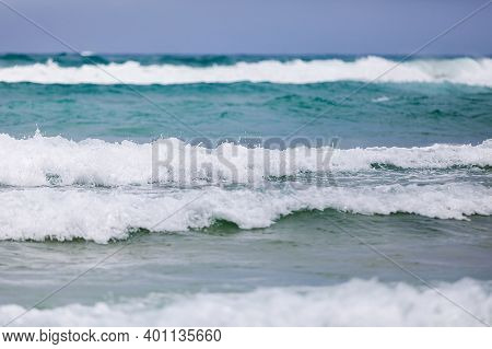 Powerful, Stormy, Foamy Waves Are Picked Up By The Wind. White Foam From Bubbles Of Different Sizes 