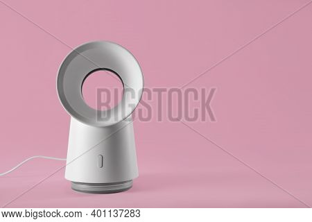 Modern Electric Fan On Pink Background. Space For Text