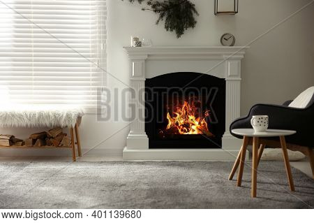 Bright Living Room Interior With Artificial Fireplace And Firewood