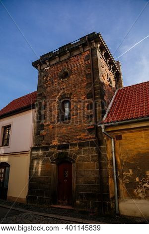 Narrow Picturesque Street With Colorful Buildings In Old Historic Center In Medieval City Slany, Yel