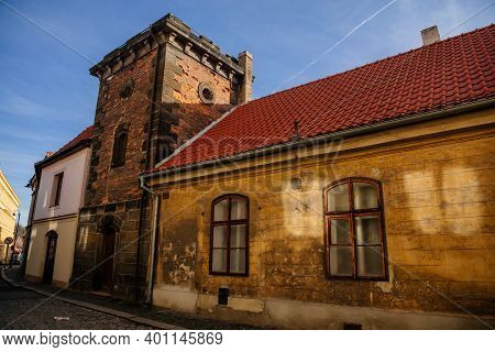 Narrow Picturesque Street With Colorful Buildings In Old Historic Center In Medieval City Slany, Yel