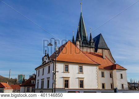 Narrow Picturesque Street With Colorful Buildings In Historic Center In Medieval City Slany, Renaiss