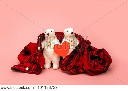 Two Polar Bears Toys With Red Heart Wrapped In Plaid Shirt On Pink Background. Concept For Dating, V
