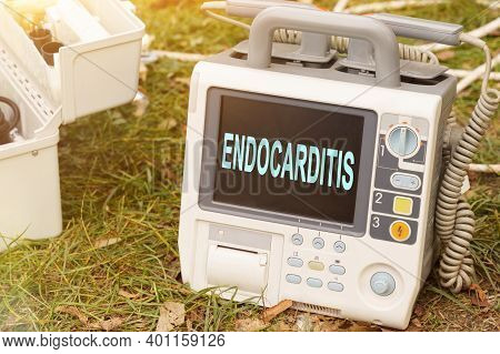 Medicine And Health Concept. The Text Is Written On The Defibrillator Monitor - Endocarditis