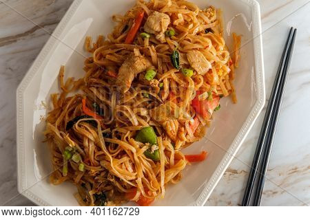 Pad Kee Mao Otherwise Known As Drunken Noodles Is A Spicy Thai Stir-fried Noodle Dish With Thinly Sl
