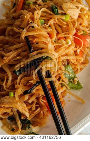 Pad Kee Mao Otherwise Known As Drunken Noodles Is A Spicy Thai Stir-fried Noodle Dish With Thinly Sl