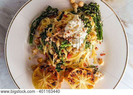 Linguine Pasta With Italian Sausage Chickpeas And Broccolini In A Creamy Ricotta Cheese Sauce