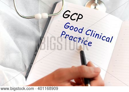Doctor Holding A Card With Text Gcp - Good Clinical Practice, Medical Concept. The Text Is Written I