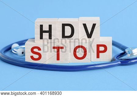 Wooden Block With Words Hdv Stop - With Stethoscope On The Table, Insurance And Medical Concept, Blu