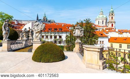 Prague Castle And St Nicholas Church In Lesser Town Of Prague. Sunny Spring Day View From Vrtba Gard