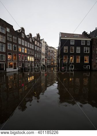 Typical Amsterdam Architecture Style Buildings Houses Grachten Canal At Oudezijds Voorburgwal Hollan