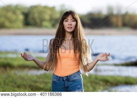 Happy Young Woman Dancing In Headphones On The Shore Of The Bay Sun Sunny Spring Day