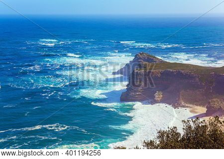 Bird's-eye view. Cape of Good Hope at the southern tip of the Cape Peninsula, South Africa. Powerful ocean surf. Bright sunny summer february day