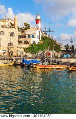 Evening twilight. Yachts anchored in the port of Old Yaffo. Old Yaffo is one of the most ancient cities in the world. Concept of active, cognitive and photo tourism