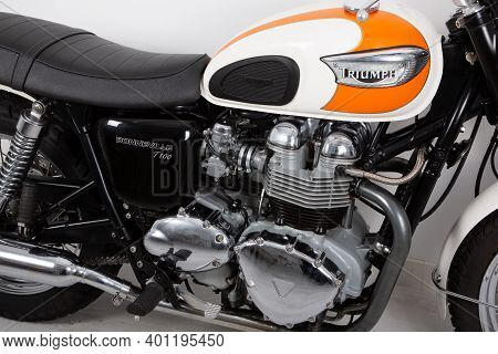 Bordeaux , Aquitaine  France - 12 25 2020 : Triumph Bonneville T100 White Orange Tank Carburetor Vin