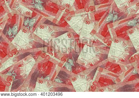 50 Philippine Piso Bills Lies In Big Pile. Rich Life Conceptual Background. Big Amount Of Money