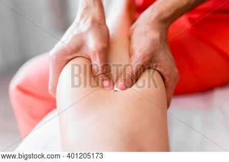 Womens Hands Massage The Athletes Legs And Shins After The Competition. Sports Massage, Recovery. Sp