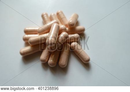 Closeup Of Handful Of Probiotic Dietary Supplements