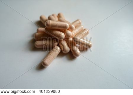 Heap Of Pink Capsules Of Probiotic Dietary Supplement
