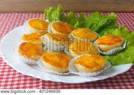Empada Or Empadinha Is A Very Popular And Traditional Snack Of Brazilian Cuisine, On A White Plate O