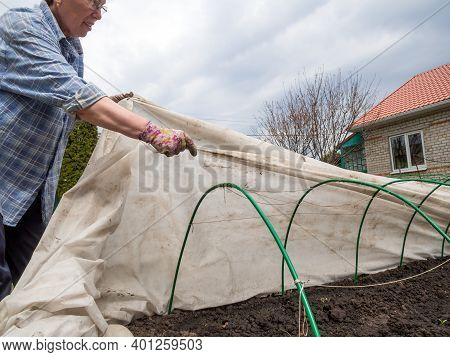 Russia, Voronezh - May 01, 2020: Covering Material Is Pulled Over Garden Arches