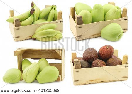 Chayote fruits (Sechium edulis), avocado's and small green snack bananas in a wooden crate on a white background