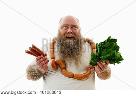 Funny Overweigh Man With A Bunch Of Sausages Around The Neck Holding Sausages And Greens In The Hand