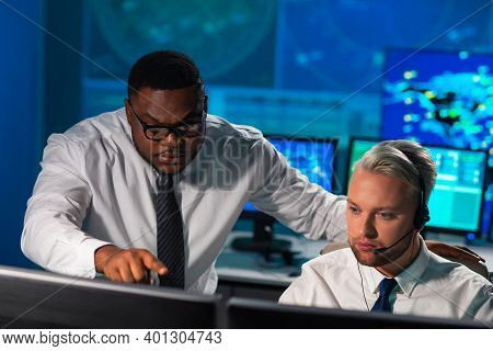 Workplace Of The Air Traffic Controllers In The Control Tower. Diverse Team Of Aircraft Control Offi