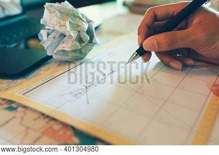 Tourist Hold Pen And Planning Vacation With Calendar And Map. Cross Line In Holiday Text And Crump P