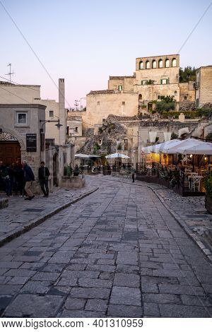 Matera, Italy - September 20, 2019: Evening View Of The City Of Matera, Italy, With The Colorful Lig