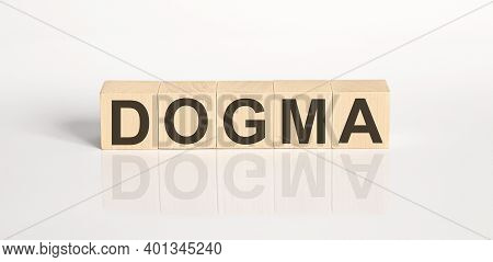 Dogma Word From Wooden Blocks On White Desk