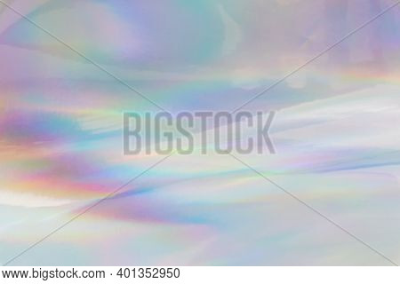 Rainbow Halographic Wrinkled Foil Background. Abstract Pastel Color Background.